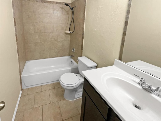 full bathroom featuring toilet, vanity, and tiled shower / bath