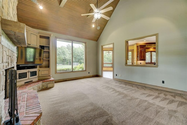 unfurnished living room featuring high vaulted ceiling, ceiling fan, a stone fireplace, and wood ceiling