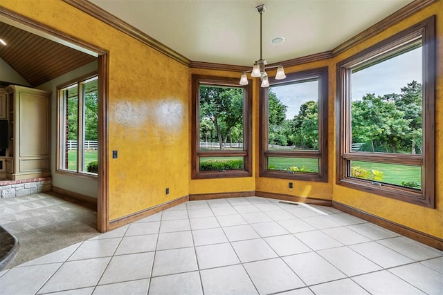 unfurnished sunroom with tile patterned flooring, vaulted ceiling, ornamental molding, carpet, and baseboards