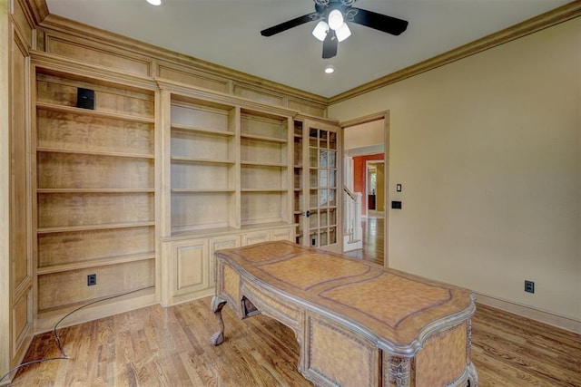 home office with baseboards, crown molding, light wood-style flooring, and ceiling fan