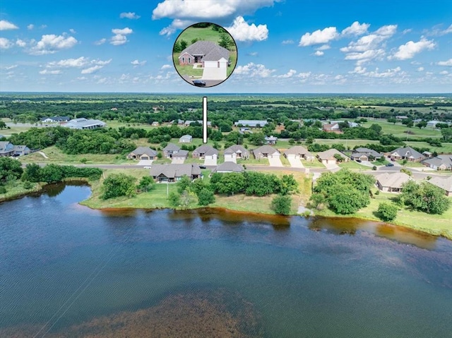 drone / aerial view with a water view