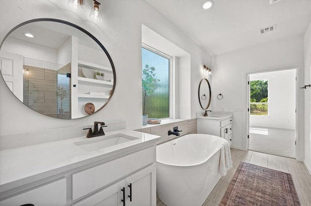 bathroom featuring vanity and plus walk in shower