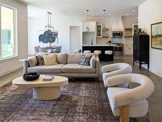 living room with dark hardwood / wood-style floors