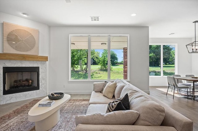 living room featuring hardwood / wood-style floors and a notable chandelier