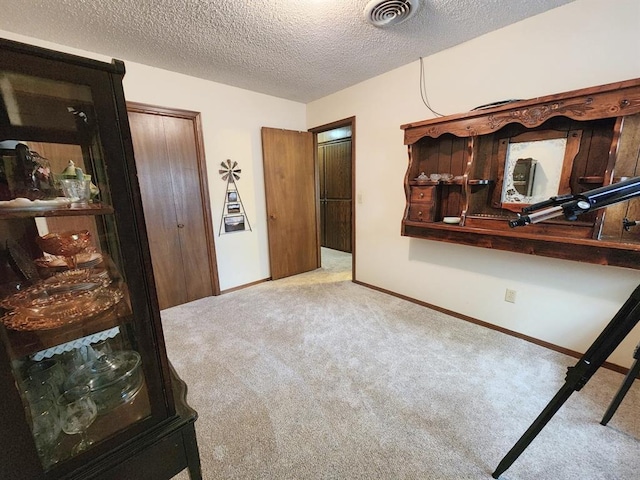 interior space with a textured ceiling