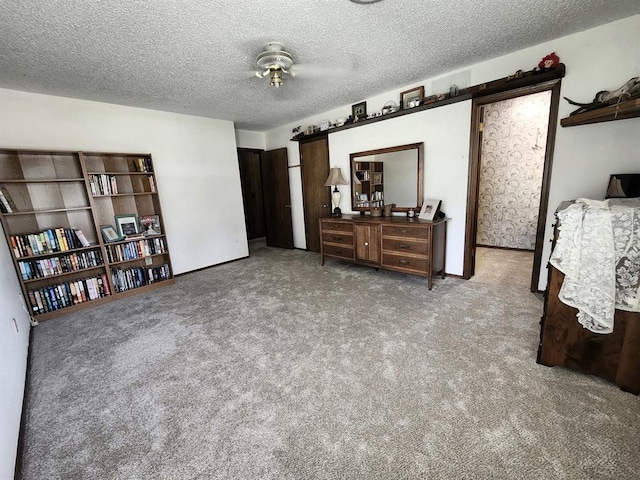 bedroom featuring carpet floors and a textured ceiling