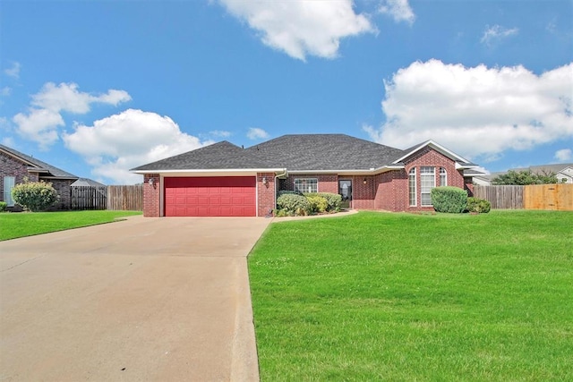 view of front of home featuring a garage and a front yard