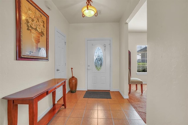 entrance foyer with light tile patterned floors