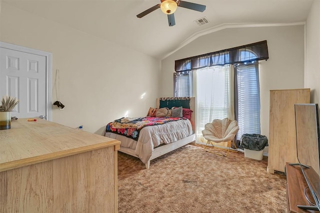 carpeted bedroom with ceiling fan and lofted ceiling