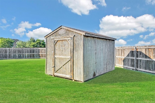 view of outdoor structure with a lawn