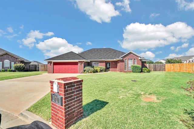 single story home with a front yard and a garage