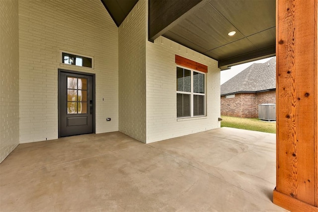 2405 Crystal Creek Dr, Yukon, OK 73099 - property entrance with brick siding and a patio area