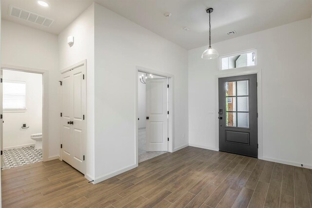 2405 Crystal Creek Dr, Yukon, OK 73099 - entryway with wood finished floors and a towering ceiling