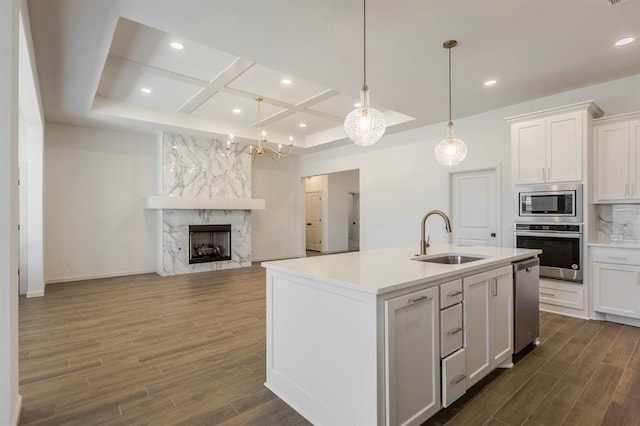2405 Crystal Creek Dr, Yukon, OK 73099 - kitchen featuring appliances with stainless steel finishes, coffered ceiling, dark wood finished floors, light countertops, and white cabinetry