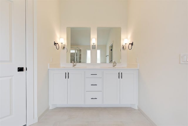 bathroom featuring tile patterned flooring, vanity, and a shower with door