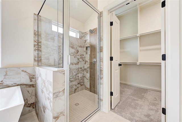 bathroom with tile patterned floors and plus walk in shower