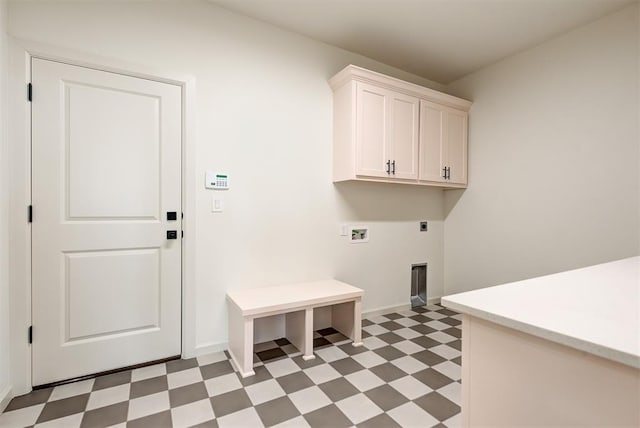 laundry area featuring hookup for an electric dryer, cabinets, and washer hookup