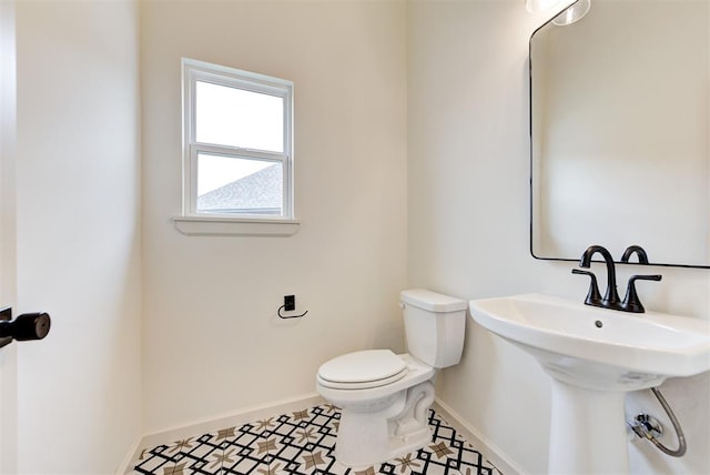 bathroom featuring tile patterned floors and toilet