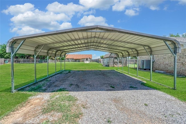 view of car parking featuring a yard and a carport