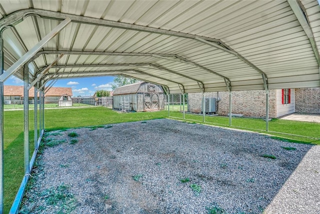 view of vehicle parking featuring a carport and a yard