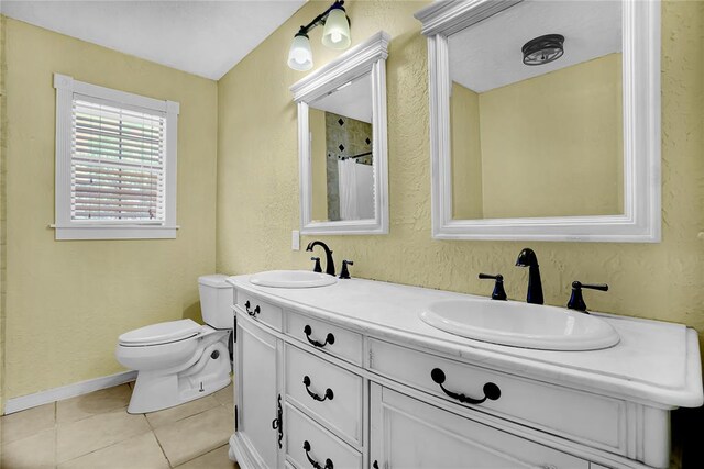 bathroom with tile patterned floors, vanity, toilet, and a shower with curtain