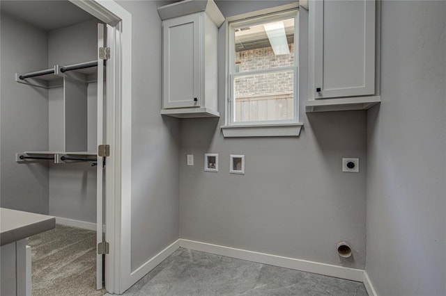 laundry room with cabinets, hookup for a washing machine, and electric dryer hookup