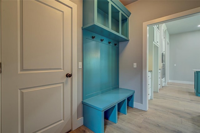 mudroom with light hardwood / wood-style floors