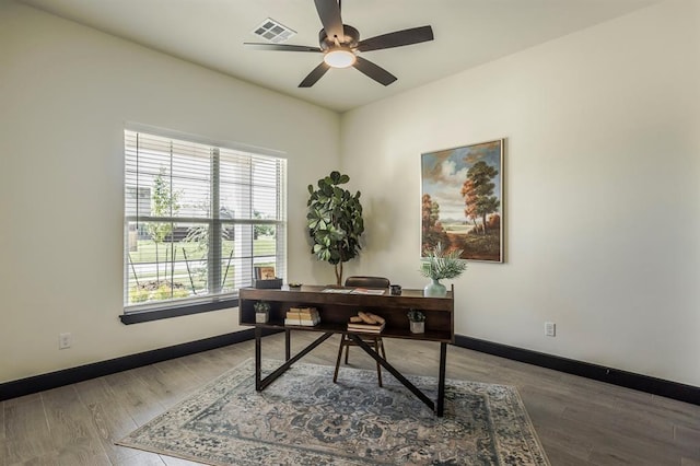 office with hardwood / wood-style floors and ceiling fan