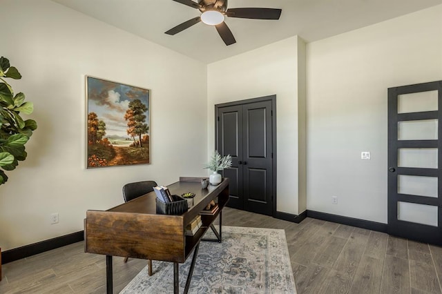 office featuring hardwood / wood-style floors and ceiling fan