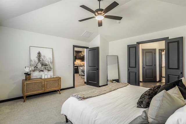 carpeted bedroom with vaulted ceiling and ceiling fan