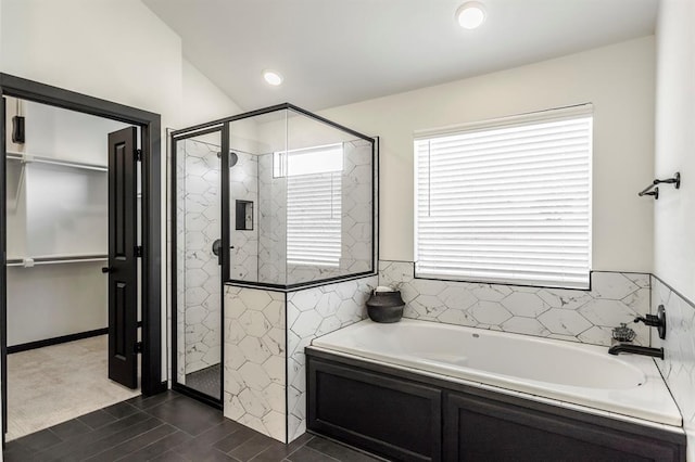 bathroom with shower with separate bathtub