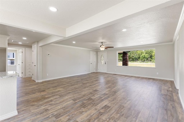 unfurnished living room featuring wood-type flooring, a textured ceiling, ceiling fan, and crown molding