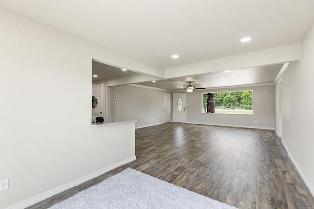 unfurnished room featuring ceiling fan and dark hardwood / wood-style flooring