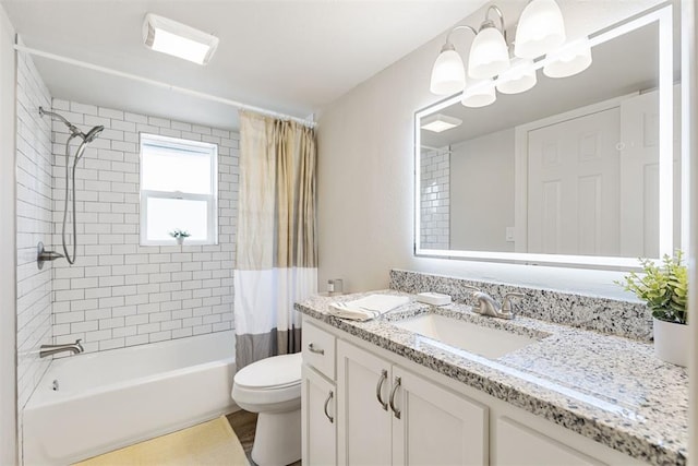 full bathroom featuring vanity, toilet, and shower / bathtub combination with curtain