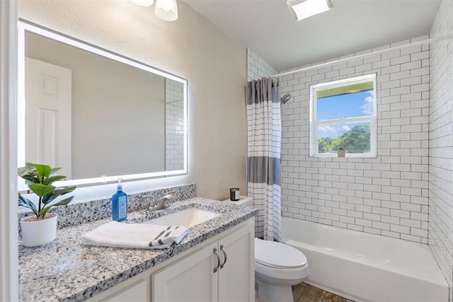 full bathroom with hardwood / wood-style flooring, vanity, toilet, and shower / tub combo with curtain