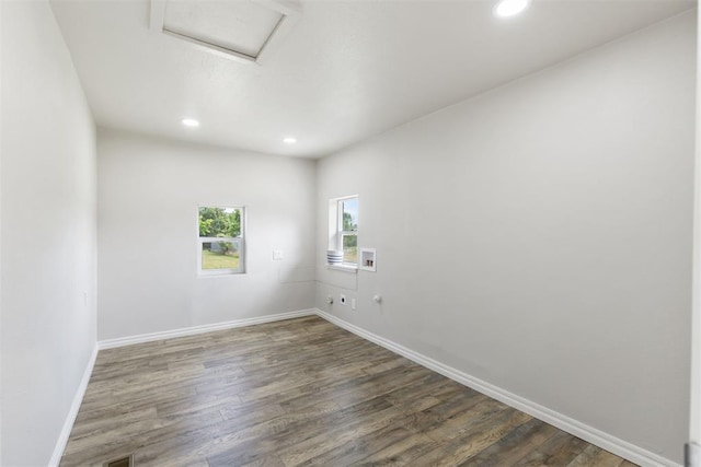 spare room with dark hardwood / wood-style flooring