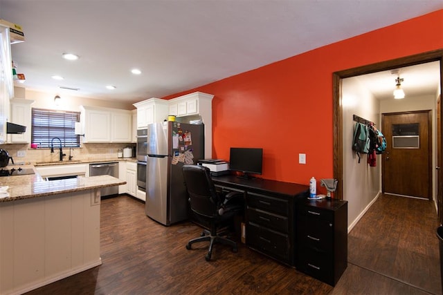 office area featuring dark wood-type flooring and sink