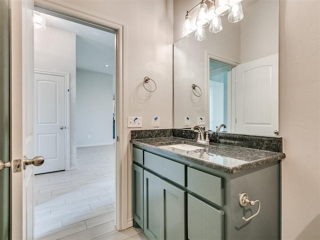 bathroom with hardwood / wood-style floors and vanity