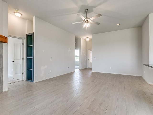 spare room featuring ceiling fan and light wood-type flooring