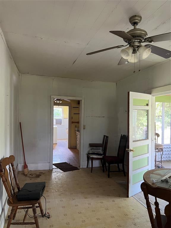 living area with plenty of natural light and ceiling fan