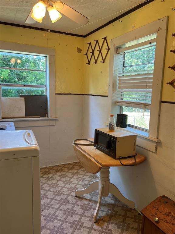 interior space featuring plenty of natural light, ceiling fan, and washer / clothes dryer