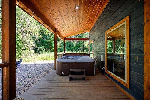 wooden terrace with a hot tub