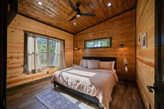 bedroom with vaulted ceiling, ceiling fan, wooden walls, wooden ceiling, and dark hardwood / wood-style floors