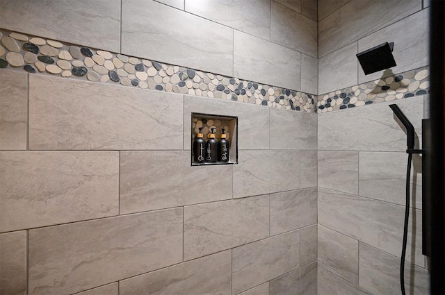 bathroom with tiled shower