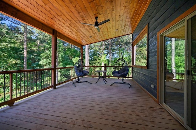 wooden terrace featuring ceiling fan