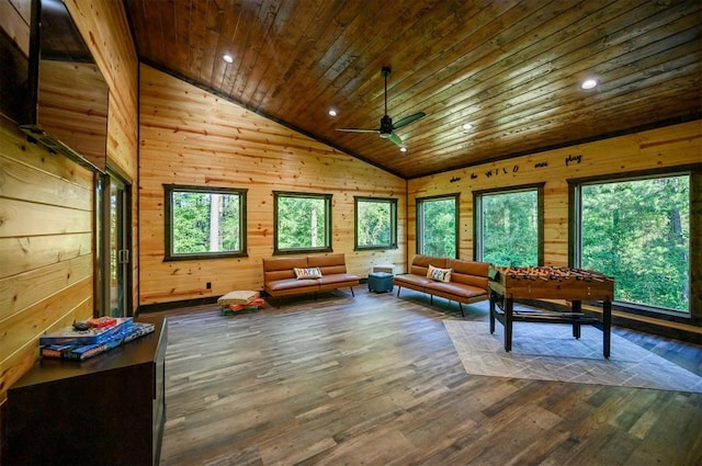 interior space with dark hardwood / wood-style floors, wooden ceiling, and a wealth of natural light