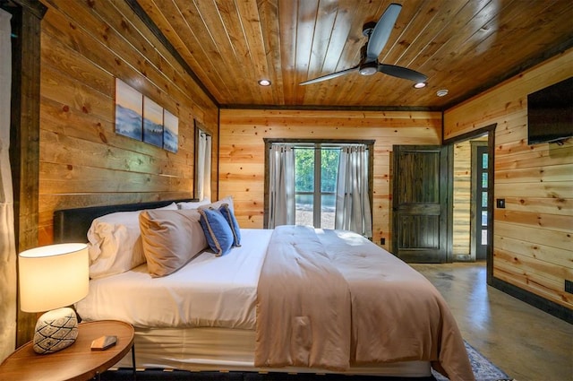 bedroom with access to exterior, wood ceiling, concrete flooring, ceiling fan, and wooden walls