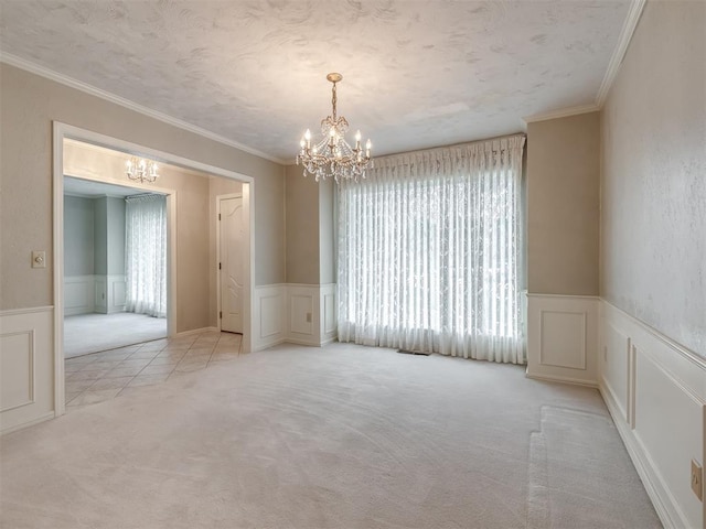 unfurnished dining area with a decorative wall, a notable chandelier, and a healthy amount of sunlight