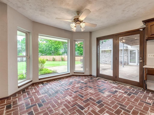 interior space with french doors and a healthy amount of sunlight