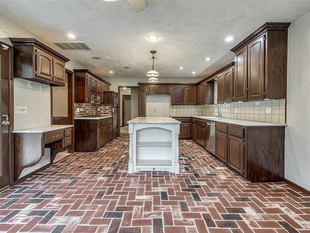 kitchen featuring open shelves, appliances with stainless steel finishes, brick floor, tasteful backsplash, and visible vents